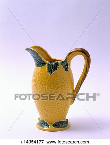 Stock Photo - Close-up of textured yellow Thirties jug. Fotosearch