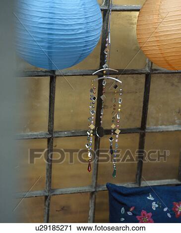 Close-up of turquoise and orange paper lampshades with jewelled ornament View Large Photo Image Stock Image - Close-up of turquoise and orange paper lampshades with jewelled ornament. Fotosearch