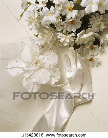 Close-up of white faux flower wedding decoration with single white satin glove View Large Photo Image Stock Photograph - Close-up of white faux flower wedding decoration with single white satin glove. Fotosearch