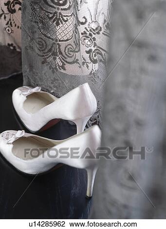 Close-up of white silk stiletto-heeled shoes View Large Photo Image Stock Image - Close-up of white silk stiletto-heeled shoes. Fotosearch