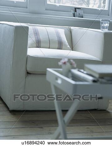 Close-up of white table and modern white armchair View Large Photo Image Stock Image - Close-up of white table and modern white armchair. Fotosearch