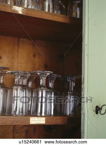 Close-up of wine glasses on wooden shelves View Large Photo Image Stock Image - Close-up of wine glasses on wooden shelves. Fotosearch