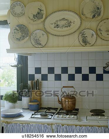 Collection of blue+white plates above copper kettle on hob View Large Photo Image Stock Photograph - Collection of blue+white plates above copper kettle on hob. Fotosearch