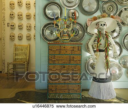 Collection of South American ceramics on green wall above painted chest of drawers View Large Photo Image Stock Photography - Collection of South American ceramics on green wall above painted chest of drawers. Fotosearch