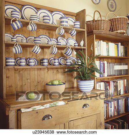 Stock Photo - Collection of T G Green blue & white striped Cornishware crockery on pine dresser. Fotosearch