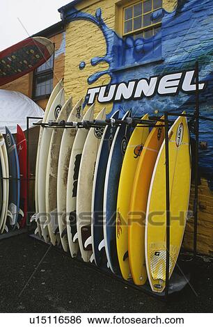 Stock Photograph - Colourful surfboards outside surfing shop in Newquay in Cornwall. Fotosearch