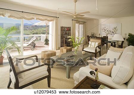 Comfortable livingroom looking onto balcony with sea view. View Large Photo Image Stock Image - Comfortable livingroom looking onto balcony with sea view.. Fotosearch