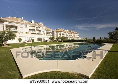 Communal swimming-pool situated in gardens in front of the villas. View Large Photo Image Stock Image - Communal swimming-pool situated in gardens in front of the villas.. Fotosearch