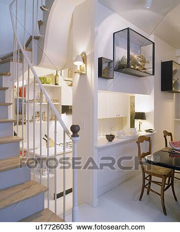 Compact modern understairs kitchen with large hatch through to dining room View Large Photo Image Stock Photography - Compact modern understairs kitchen with large hatch through to dining room. Fotosearch