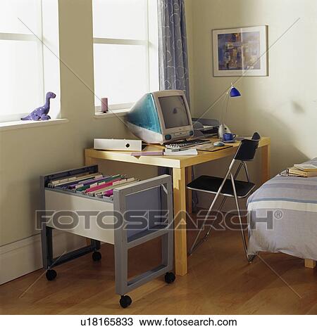 Computer On Small Desk In Study Area Of Child S Modern Bedroom