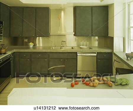 Concrete worktops on dark grey fitted units in modern kitchen View Large Photo Image Stock Image - Concrete worktops on dark grey fitted units in modern kitchen. Fotosearch
