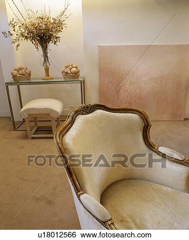 Cream armchair in French townhouse living room View Large Photo Image Stock Photograph - Cream armchair in French townhouse living room. Fotosearch