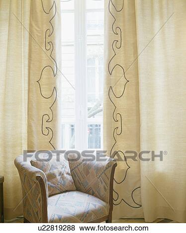 Cream Tub Chair In Front Of Window With Embroidered Cream