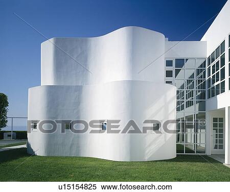 Stock Photography - Curved white wall on large architectural house by the ocean in Malibu, California. Fotosearch