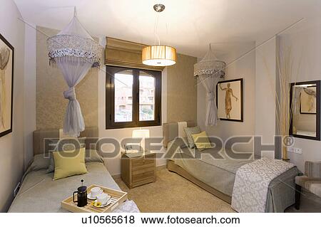 Decorative mosquito nets over twin single beds in Spanish hotel room. View Large Photo Image Stock Photo - Decorative mosquito nets over twin single beds in Spanish hotel room.. Fotosearch