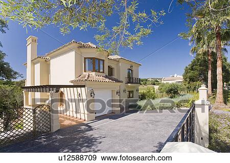 Exterior of modern detached house in Southern Spain. View Large Photo Image Stock Photo - Exterior of modern detached house in Southern Spain.. Fotosearch