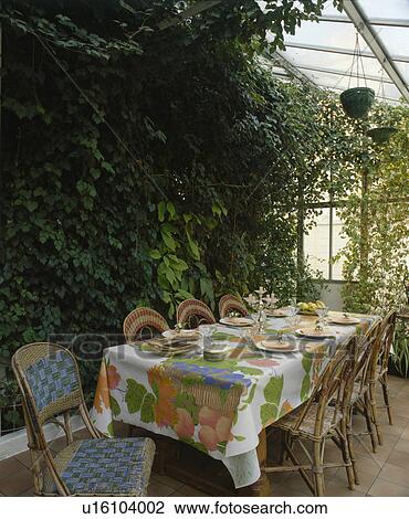 Floral cloth on table in conservatory dining room View Large Photo Image Stock Image - Floral cloth on table in conservatory dining room. Fotosearch