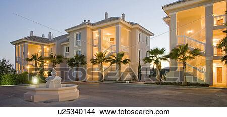 Fountain at front of development of large houses in Southern Spain. View Large Photo Image Picture - Fountain at front of development of large houses in Southern Spain. . Fotosearch