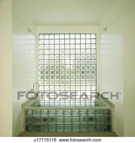Glass brick window above glass brick bath in modern bathroom View Large Photo Image Stock Photograph - Glass brick window above glass brick bath in modern bathroom. Fotosearch