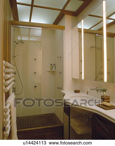 Glass Ceiling In Modern Bathroom With Strip Lighting On The Side