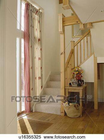 Stock Photography - Grey carpet on open wooden staircase in modern white hall. Fotosearch