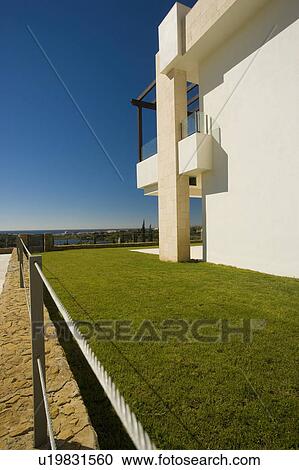 Stock Image - HOTEL LOOKING OVER THE GOLF COURSE.. Fotosearch