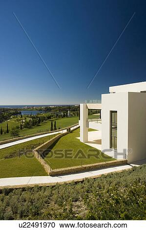 HOTEL LOOKING OVER THE GOLF COURSE. View Large Photo Image Stock Image - HOTEL LOOKING OVER THE GOLF COURSE.. Fotosearch