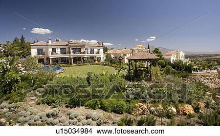 Large detached villa in hills above the coast with newly landscaped garden. View Large Photo Image Picture - Large detached villa in hills above the coast with newly landscaped garden.. Fotosearch