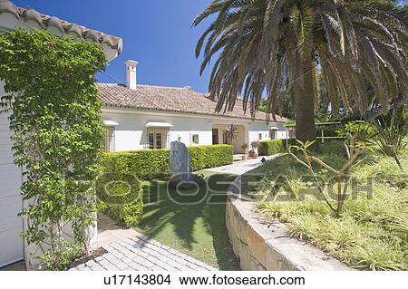 Large detached villa sounded by gardens. View Large Photo Image Picture - Large detached villa sounded by gardens.. Fotosearch