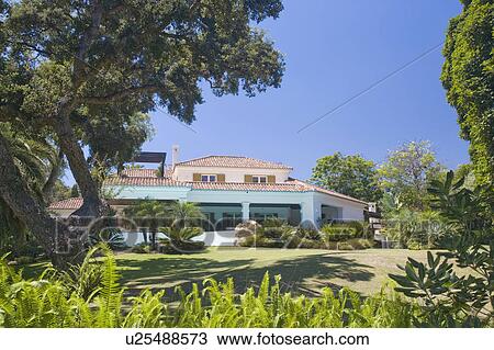Large detached villa sounded by gardens. View Large Photo Image Stock Image - Large detached villa sounded by gardens.. Fotosearch