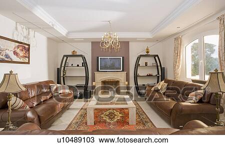Large leather sofas either side of modern livingroom. View Large Photo Image Stock Image - Large leather sofas either side of modern livingroom.. Fotosearch