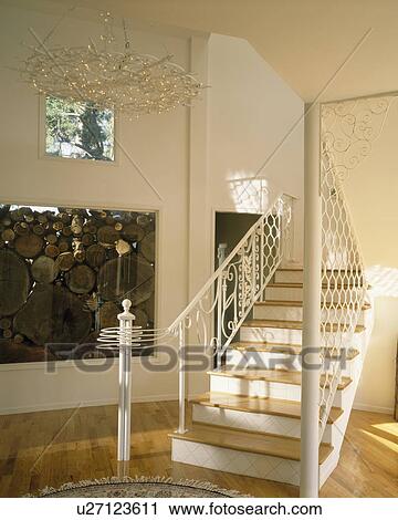 Large picture and white staircase in modern white hall View Large Photo Image Stock Image - Large picture and white staircase in modern white hall. Fotosearch