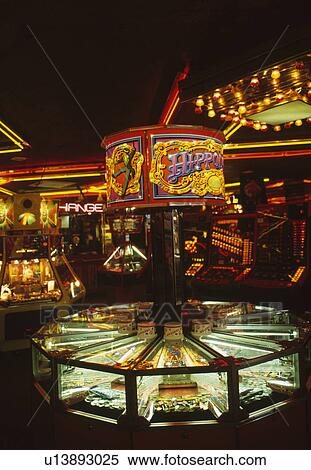 Stock Photography - Lighted rides in fairground at night. Fotosearch