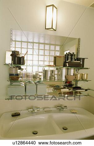 Lighting above glass shelves and double white basins View Large Photo Image Stock Image - Lighting above glass shelves and double white basins. Fotosearch