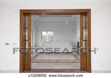 Livingroom in the Mclundie apartment through sliding doors. View Large Photo Image Stock Image - Livingroom in the Mclundie apartment through sliding doors. . Fotosearch