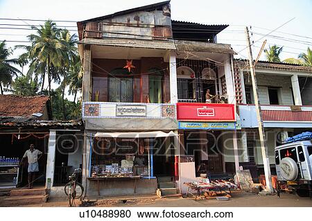 Stock Image - Local shops and traders in small Indian town.. Fotosearch