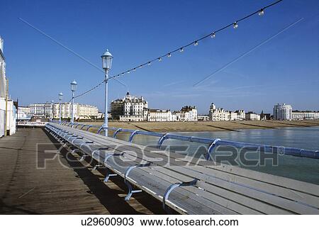 Long bench seating on the pier at Eastbourne in Sussex View Large Photo Image Stock Image - Long bench seating on the pier at Eastbourne in Sussex. Fotosearch