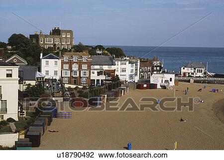Stock Image - Looking down on houses and beach huts on the beach at Broadstairs in Kent. Fotosearch