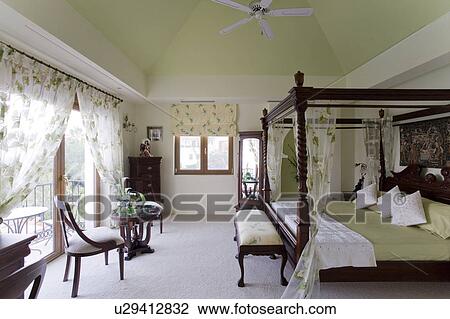 Mclundie apartment with four poster bed and ceiling fan. View Large Photo Image Stock Image - Mclundie apartment with four poster bed and ceiling fan.. Fotosearch