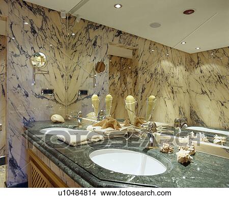 Mirrored wall above underset basins in green marble vanity unit View Large Photo Image Picture - Mirrored wall above underset basins in green marble vanity unit . Fotosearch