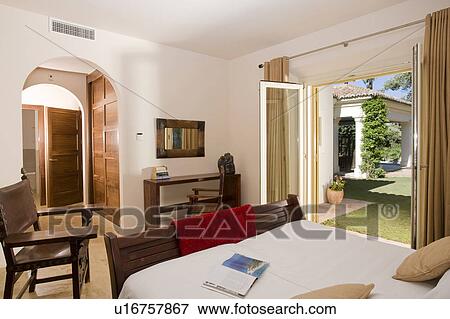 Modern bedroom suite overlooking the garden. View Large Photo Image Stock Photo - Modern bedroom suite overlooking the garden.. Fotosearch