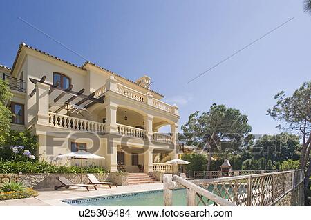 Picture - Modern detached house overlooking swimming pool in Southern Spain.. Fotosearch