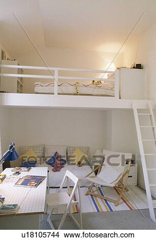 Modern white studio apartment with mezzanine bedroom View Large Photo Image Picture - Modern white studio apartment with mezzanine bedroom. Fotosearch