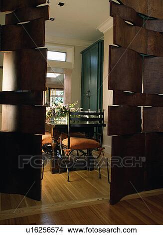 Picture - Modern wooden sectioned doors to modern dining room. Fotosearch