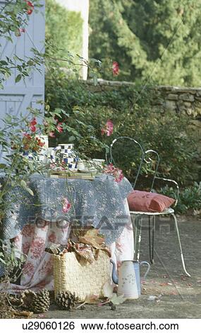 Old quilts used as table cloths on circular table in courtyard garden View Large Photo Image Stock Photograph - Old quilts used as table cloths on circular table in courtyard garden. Fotosearch
