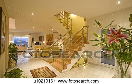 Stock Photo - Openplan Mclundie villa with stairs going up out of hall area.. Fotosearch