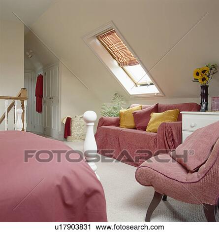 Pink throw and bedlinen in loft conversion bedroom with blind on velux window View Large Photo Image Stock Image - Pink throw and bedlinen in loft conversion bedroom with blind on velux window. Fotosearch