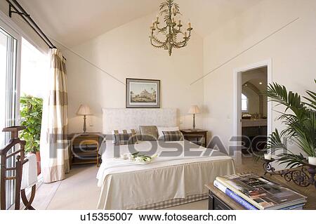 Plain lightl bedroom leading onto balcony. 
 
 View Large Photo Image Stock Photo - Plain lightl bedroom leading onto balcony. 
 
. Fotosearch