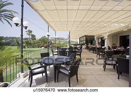 Restaurant under awning overlooking golf course. View Large Photo Image Stock Image - Restaurant under awning overlooking golf course.. Fotosearch
