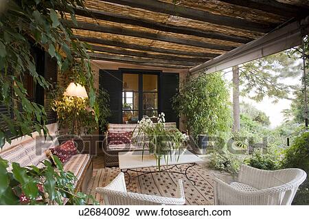Rustic terrace with green plants and rugs. View Large Photo Image Stock Image - Rustic terrace with green plants and rugs.. Fotosearch
